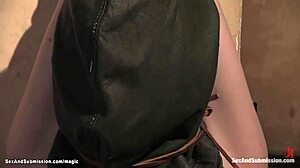 Hooded and bound ginger experiences intense anal play