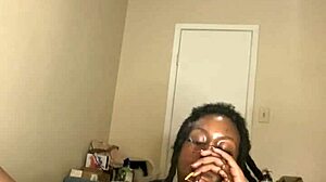 Ebony MILF masturbates with dildo and smokes