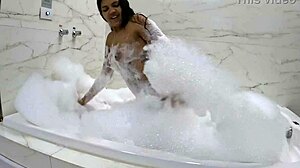 I indulge in a sensual foam bath with a stunning black cock